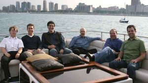 A group of men on a charter yacht in Chicago IL, you can see the city in the background