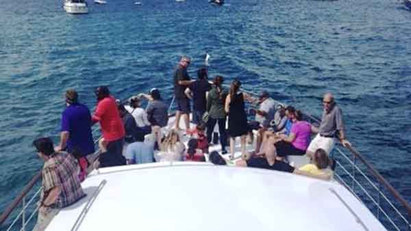 a party of guests taking a yacht tour of Chicago